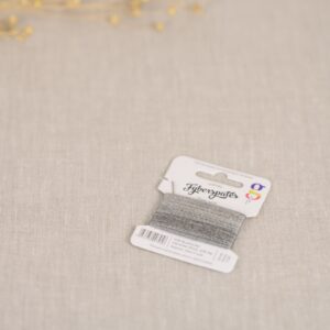 a close up of grey embroidery thread